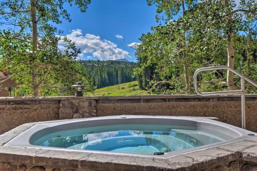 a hot tub in a stone wall with a view at Beaver Run Resort 4228 - Dog Friendly in Breckenridge