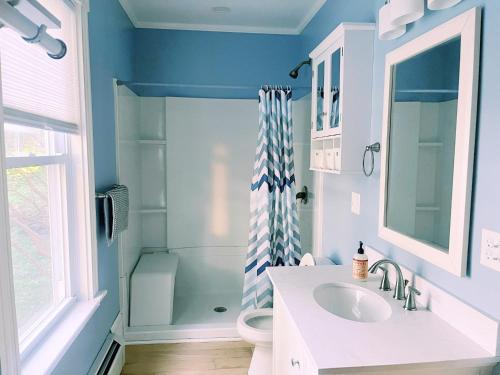 a bathroom with a sink and a shower at Cozy 1Br Apt in Bangor