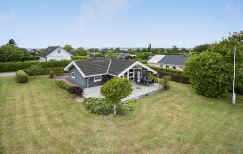 an aerial view of a house with a yard at Three-Bedroom Holiday Home In Assens in Assens