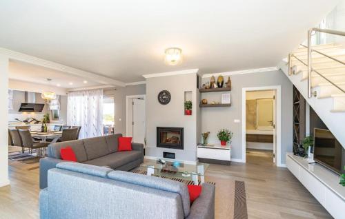 a living room with a couch and a table at Awesome Home In Blato in Blato