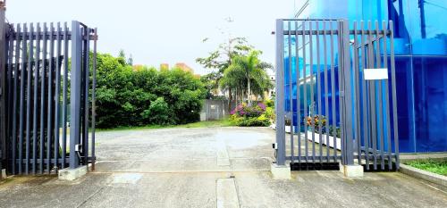 a pair of gates in a parking lot at Hotel Blue 66 in Cali