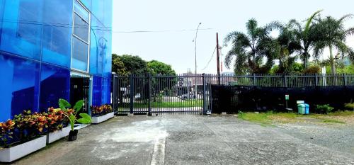 a black iron gate in front of a building at Hotel Blue 66 in Cali