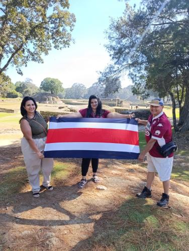 a group of people holding a large flag at Hotel Rholyn Pura Vida!! in Antigua Guatemala