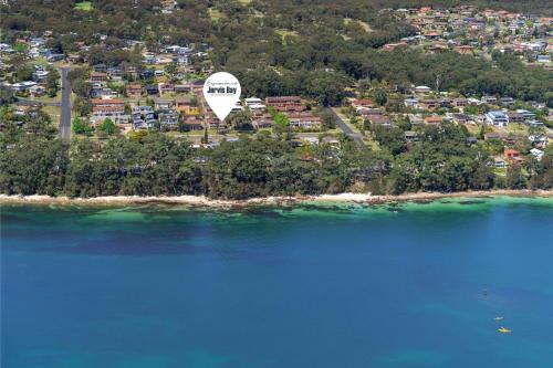 an aerial view of an island with a hot air balloon at Kalimna by Experience Jervis Bay in Vincentia
