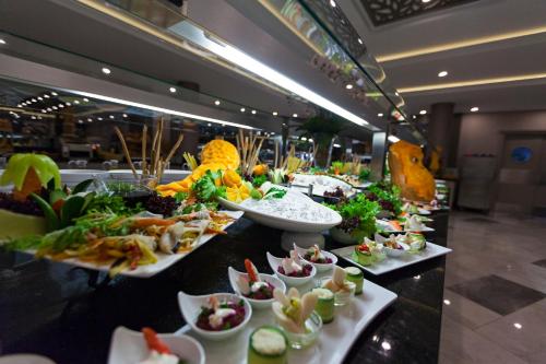 a buffet line with many different types of food at Samara Hotel Bodrum Ultra All Inclusive in Torba