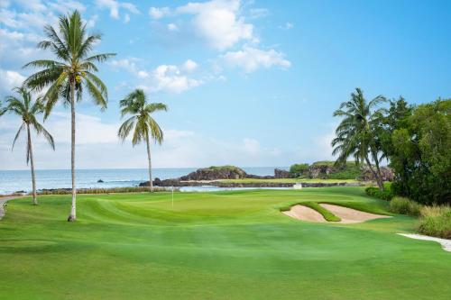 a view of a golf course with palm trees at Hacienda De Mita, Close to Ocean and Golf in Punta Mita