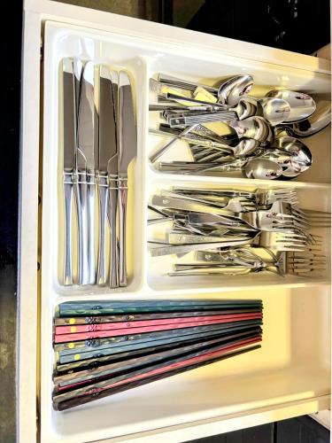 a drawer full of utensils in a white container at 小江戸川越まで車で12分 6名 in Kawagoe