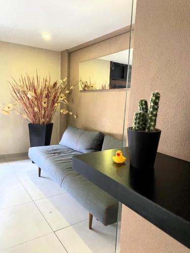a living room with a couch and a table at S03 SUITE CON CAMA KING SIZE Premium Frente al TEC CEM con Cocineta WiFi Balcón Parking Terraza 10 in Mexico City