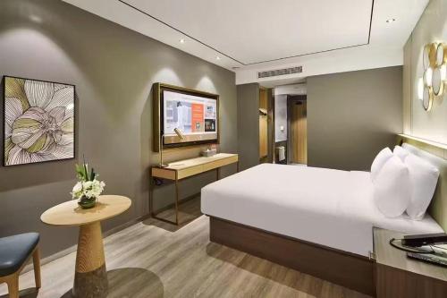 Voodi või voodid majutusasutuse Crystal Orange Hotel Shanghai Hongqiao Hub Railway Station toas