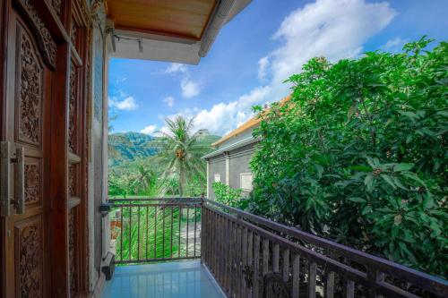 a balcony with a view of the mountains at Sekarinis Place in Amed