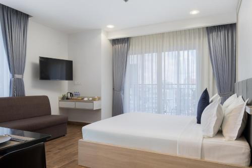 Amana Hotel & Residencesにあるテレビまたはエンターテインメントセンター