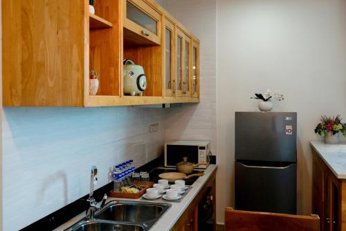 Amana Hotel & Residencesにあるキッチンまたは簡易キッチン