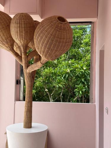 two baskets on a table in front of a window at Flowering Villa in Xiaoliuqiu