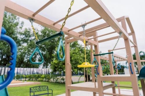 a swing set at a playground at The Mansion Boutique Hotel in Mabalacat