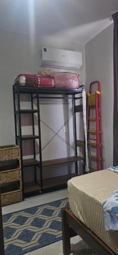 a room with a shelf with a bed and a mattress at بيت الروبي in Ain Sokhna