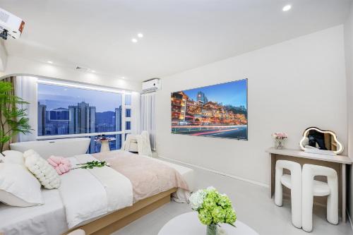 Postel nebo postele na pokoji v ubytování Baihong Riverview aparment-Chongqing Jiefangbei