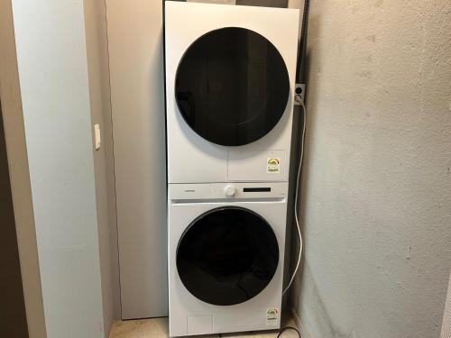 a washer and dryer in a wall at ADO hotel in Seoul