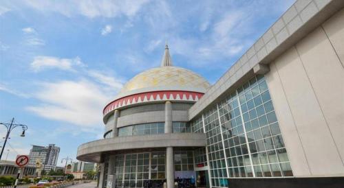 a building with a gold dome on top of it at The CentrePoint Hotel in Bandar Seri Begawan