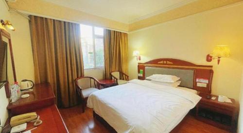 Postel nebo postele na pokoji v ubytování Jintone Hotel Beiliu Yongan Branch
