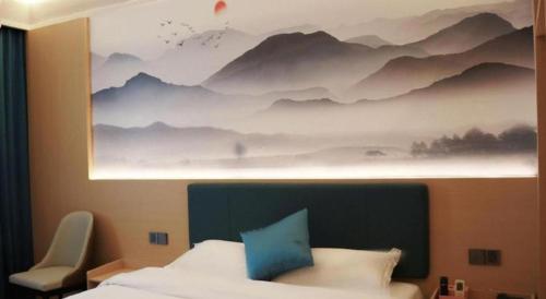 Postel nebo postele na pokoji v ubytování Jintone Hotel Beiliu Yongan Branch