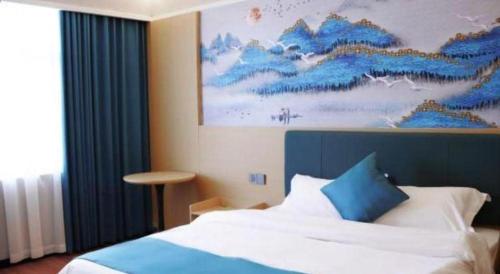 Postel nebo postele na pokoji v ubytování Jintone Hotel Beiliu Yongan Branch