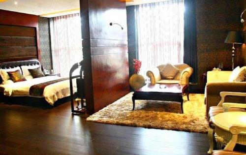 Ένα ή περισσότερα κρεβάτια σε δωμάτιο στο Metropark Hotel
