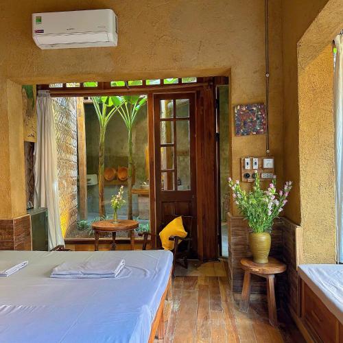 Postel nebo postele na pokoji v ubytování Đoài homestay Đường Lâm