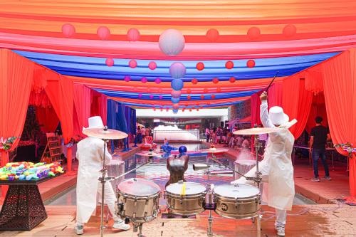 two men playing drums in a stage at SO/ Sofitel Hua Hin in Cha Am
