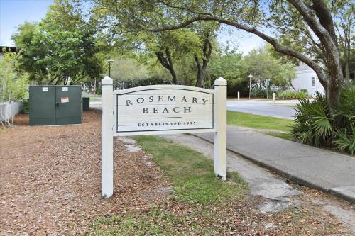 a sign for a beach on the side of a street at Sand Pointe by 30A Escapes in Inlet Beach