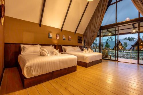 Postel nebo postele na pokoji v ubytování Hom I Din Farm and Homestay