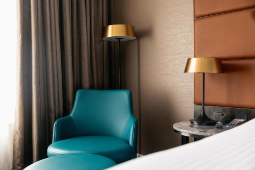 Postel nebo postele na pokoji v ubytování Mercure Sydney Parramatta