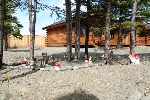 a group of toy figurines in front of a cabin at Moose-AKa's Cabins in Healy