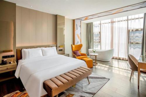 Katil atau katil-katil dalam bilik di Tomeet Hotel