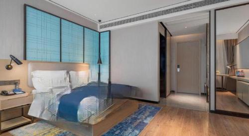 Ένα ή περισσότερα κρεβάτια σε δωμάτιο στο Echarm Hotel Zhuzhou Liling