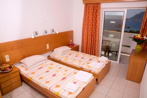 Postel nebo postele na pokoji v ubytování Pantheon Hotel