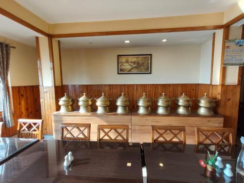 a court room with a row of metal containers at Hotel Utpala in Gangtok