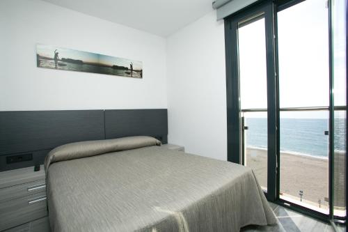 Кровать или кровати в номере Apartamentos Fuengirola Playa