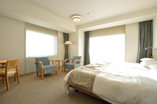 Postel nebo postele na pokoji v ubytování Hotel Nikko Niigata