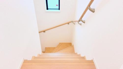 a staircase in a house with a window at Villa Hiyori -日和- in Yofuke