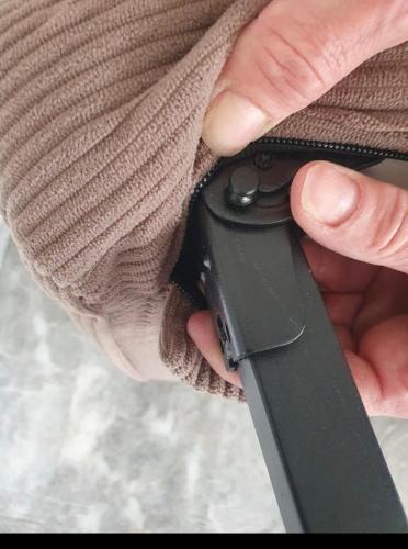 a person holding a remote control in their hand at Κήπος μέ τις πορτοκαλιές in Mytilini