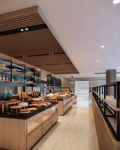 a bakery with many different types of food on display at Fairfield by Marriott Bali Kuta Ngurah Rai in Kuta