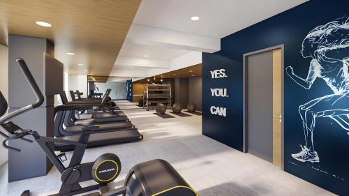 a gym with cardio equipment in a hotel room at Fairfield by Marriott Bali Kuta Ngurah Rai in Kuta