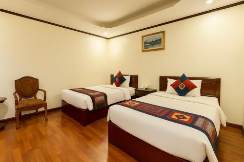 Katil atau katil-katil dalam bilik di An Nam Hotel Sapa
