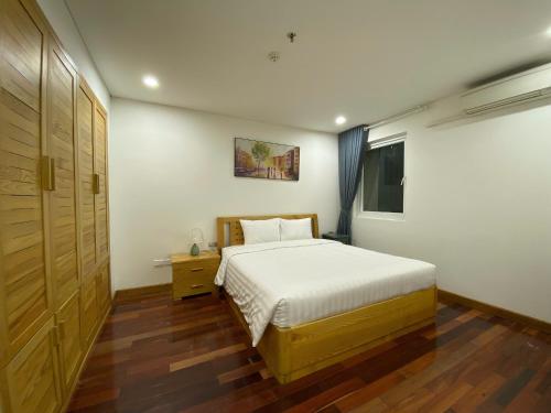 Ένα ή περισσότερα κρεβάτια σε δωμάτιο στο Mira Apartment & Hotel