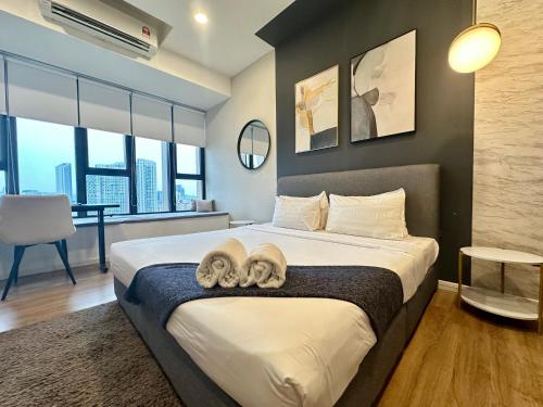 Un ou plusieurs lits dans un hébergement de l'établissement Ceylonz Suites KLCC By KL Tower