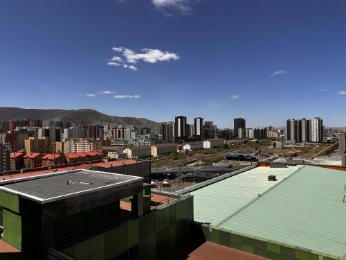 a view of a city with buildings in the background at Bojon Hotel Ulaanbaatar - Soyolj Mall in Ulaanbaatar