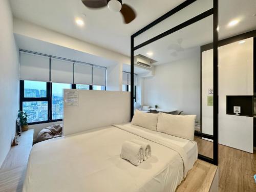 Un ou plusieurs lits dans un hébergement de l'établissement Ceylonz Suites KLCC By KL Tower