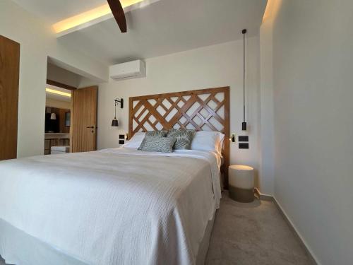Giường trong phòng chung tại Utopia Luxury Suite