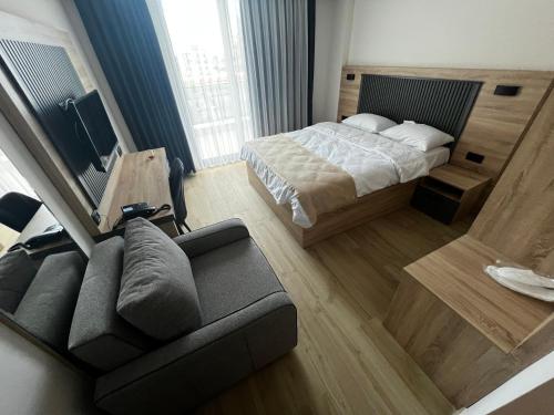 Postel nebo postele na pokoji v ubytování Konfor Hotel
