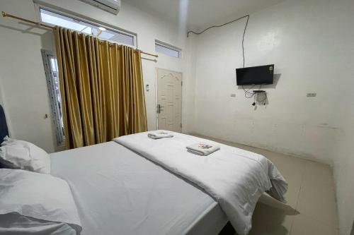 Televisyen dan/atau pusat hiburan di Agave Hotel Siantar